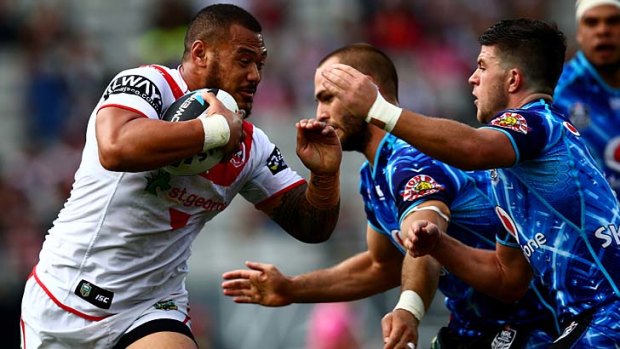 Fiery: Leeson Ah Mau of the Dragons is tackled during his team's 31-12 victory at Eden Park on Saturday.