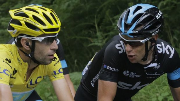 Friendly chat: Tour leader Vincenzo Nibali (left) talks with Richie Porte as they ride in the peloton.