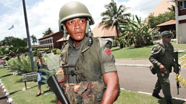 A Fijian soldier patrols after a bloodless coup in Suva in 2006