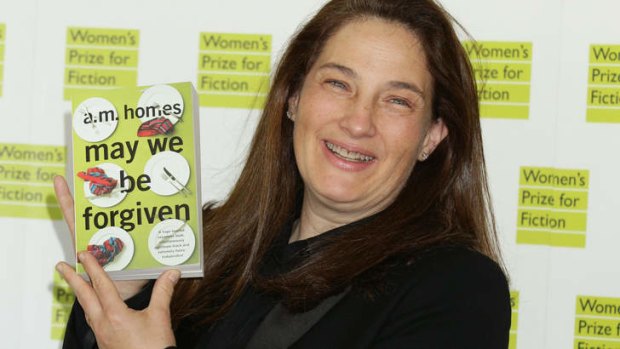 American novelist A.M. Homes  holds a copy of her award-winning book <i>May We Be Forgiven</i> at the Royal Festival Hall, London.