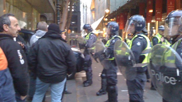 Police in riot gear at the Grocon site in the CBD this morning.