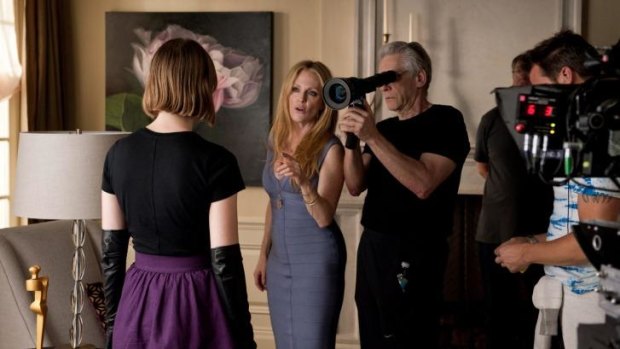 On the set: Cronenberg at work on <i>Maps to the Stars</i> with Mia Wasikowska (left) and Julianne Moore.