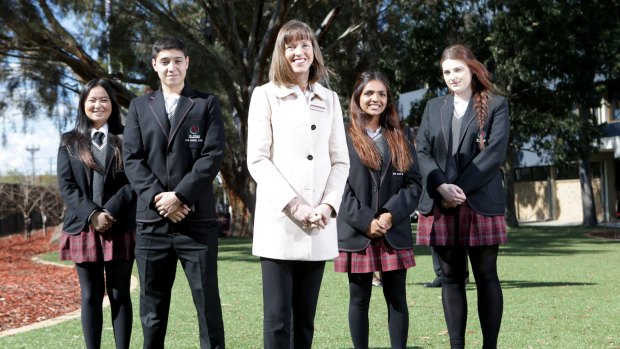 A for effort: St Albans Secondary College principal Kerry Dowsley poses for a photo with students Francisco Passadore-Rocha, Christie Vo, Brigitte Thomas and Nikolina Arnaut on the school grounds. 