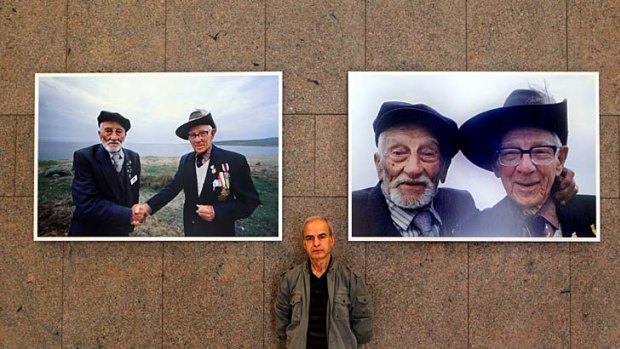 "They were laughing and joking as if they had been comrades" ... Turkish-born photojournalist Vedat Acikalin below the photos he took at Gallipoli in 1990 for the 75th anniversary of the campaign.