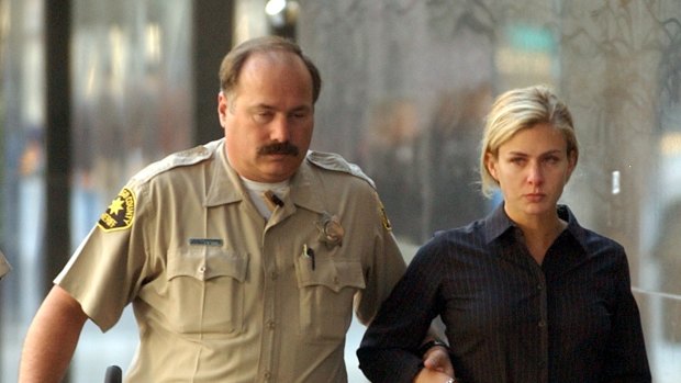 Kristin Rossum is escorted by a sheriff's deputy in 2002.