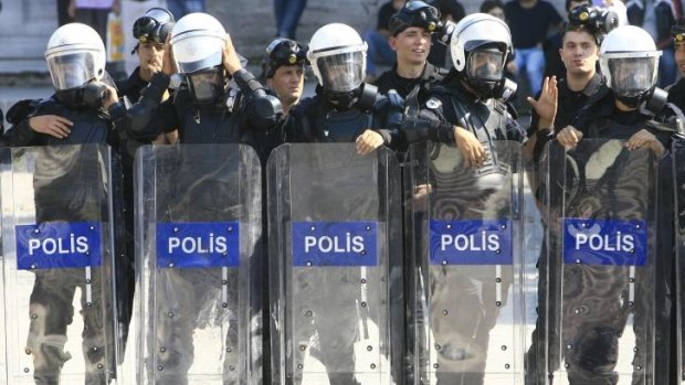 Firing line: Turkish police are on the other end of a government crackdown, with 350 losing their jobs at midnight.