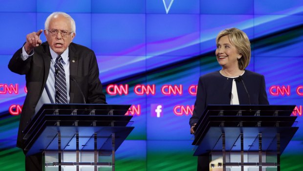 Senator Bernie Sanders, of Vermont, left, speaks as Hillary Rodham Clinton looks on.