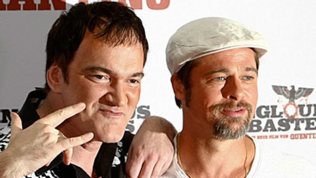 Bucking the trend ... Quentin Tarantino and Brad Pitt promote "Inglourious Basterds", which is tracking well at the box office.