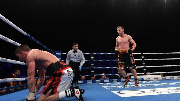 On the canvas: Gary Corcoran takes a fall during his fight against Jeff Horn.