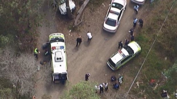 Police and emergency crews at the scene of a police shooting in Rochedale South.