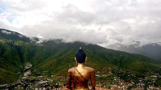 The giant Buddha Dordenma statue, still under-construction, overlooks the capital city of Thimphu in Bhutan.