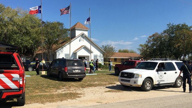 Investigators work at the scene of a deadly shooting at the First Baptist Church in Sutherland Springs, Texas.