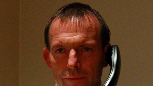 Marathon man ... Tony Abbott conducts a live radio interview by telephone at 2.45am
