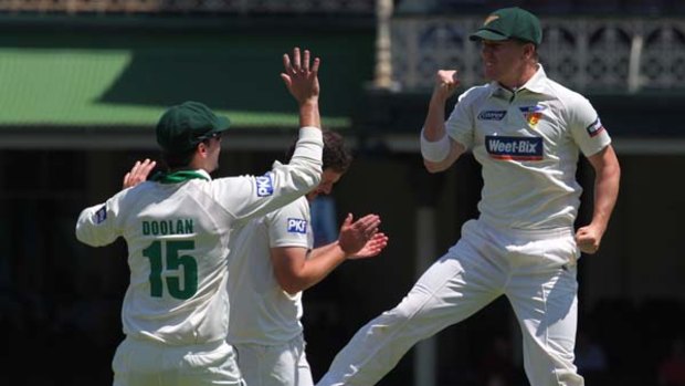 Top of the morning ... Xavier Doherty celebrates running out Shane Watson.