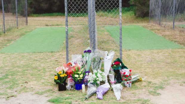 Flowers and cards left in memory of Luke Batty at Tyabb oval in front of the nets where he ws murdered