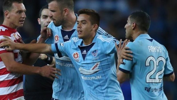Confrontation: Brendan Santalab (L) clashes with Ali Abbas during the fiery Sydney derby.