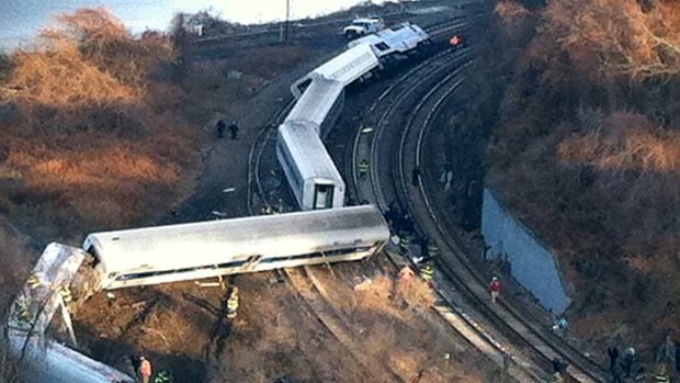 Cars from a Metro-North passenger train are scattered after the train derailed in the Bronx neighbourhood of New York.