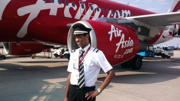 Co-pilot of the ill-fated AirAsia flight QZ850 Remi Emmanuel Plesel, who is from the French island of Martinique, posing in front of an Air Asia aircraft.