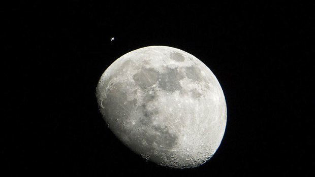 This NASA photograph released on January 17 juxtaposes Earth's oldest satellite with one of its youngest. The Moon is thought to have been formed  4.6 billion years ago. The International Space Station started orbiting Earth in 1998.