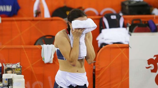 Cannot believe it ... Victoria Pendleton puts her head in her towel after being disqualified.