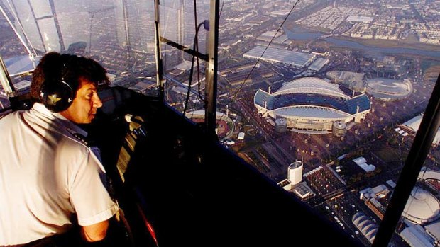Michael Nerandzic pilots an airship over Homebush Bay, Sydney, in 2000.