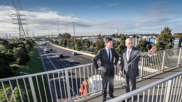 Roads Minister Luke Donnellan and Peter Sammut, chief executive of the Western Distributor Authority, in Yarraville on Monday. 