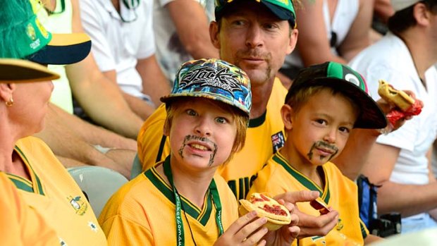 Declan Cox enjoying a pie at the game.