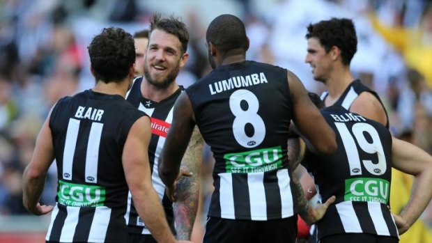 Name game: Collingwood players don jumpers featuring surnames in round five.