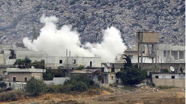 Smoke rises ... a recent attack on the border town of Azmarin.