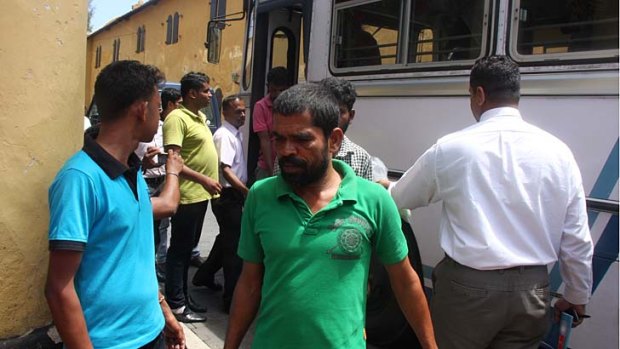 Asylum seeker being delivered to court in Galle on Tuesday, after Australian authorities handed the group of 41 over to the Sri Lanka navy. The Australian High Court will now determine the fate of those on a second boat.