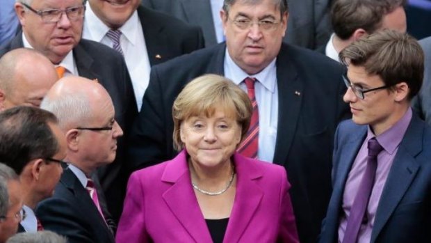 German Chancellor Angela Merkel in the Bundestag on Wednesday. She has told Britain's David Cameron that he will fail in his bid to prevent Jean-Claude Juncker becoming next head of the European Commission.