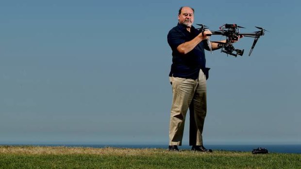 Eye in the sky ... Mark Pearson of Animal Liberation Society NSW with a helicopter drone they have purchased to fly over farms.