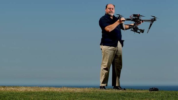 SMH  -  Mark Pearson who is head of Animal Liberation Society NSW wit a helicopter drone they have purchased to fly over farms   28th March 2013 picture by Ryan Osland