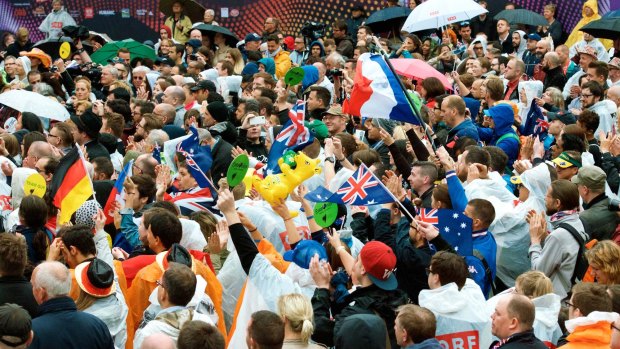 Aussie fans join the crowd at the Eurovillage in Vienna to see Guy Sebastian perform.