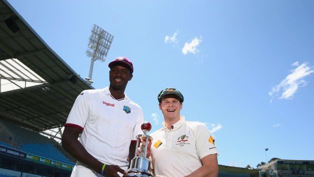 Up for grabs: West Indies captain Jason Holder and Australian captain Steve Smith pose with the Frank Worrell Trophy at Blundstone Arena.