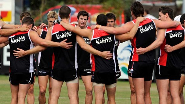 Brothers in arms: Lenny Hayes (back centre) with the Saints at training yesterday.