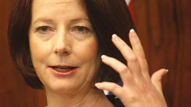 Prime Minister Julia Gillard, sans ring, at a press conference last Friday.