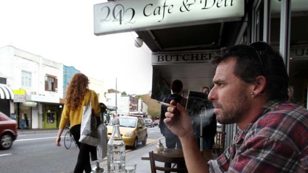 Restricted ... patron Gareth Johnson has a cigarette at 2042 Cafe & Deli on King Street, Newtown.