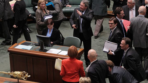 Prime Minister Julia Gillard leaves the House after terminating question time yesterday.