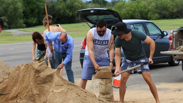 Huge piles of sand were dumped at Lou Lister Park for local residents to dig into with shovels and sandbags.