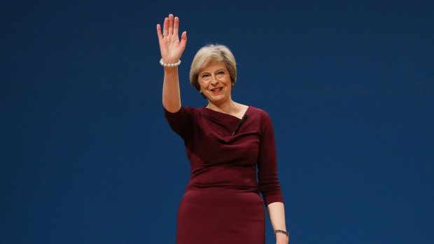 Theresa May, U.K. prime minister and leader of the Conservative party, waves to the crowd after delivering the closing speech at the party's annual conference in Birmingham, U.K., on Wednesday, Oct. 5, 2016. The pound has fallen 1.8 percent to a 31-year low against the dollar since the start of her Conservative Party's annual conference amid investor concerned that Britain could be heading for a ?hard Brexit,? with little accommodation for the finance industry. Photographer: Chris Ratcliffe/Bloomberg