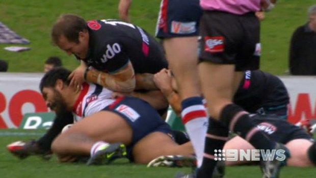 Painful ... Travis Burns's alleged chicken wing tackle on Mose Masoe.
