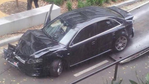 Smashed up ... this car was towed away from UNSW, a witness said.