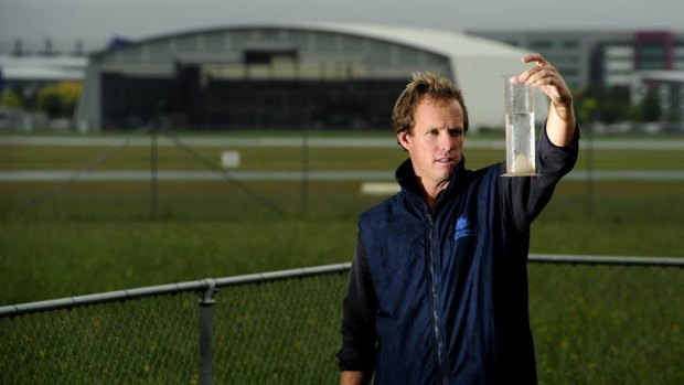 Watching the weather ... senior meteorologist Sean Carson checks rainfall at Canberra Airport.
