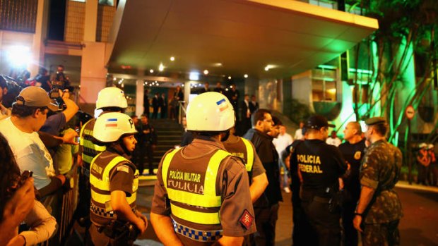 In safe hands: Police and military personnel stand guard at the Socceroos' hotel in Vitoria, Brazil.