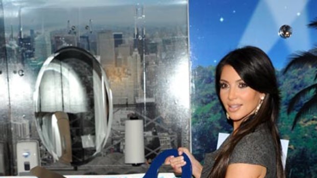Plumbing new depths ... Kim Kardashian opens a public toilet in New York.