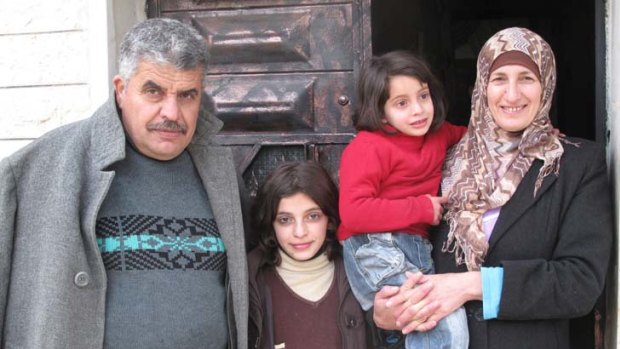 In the firing line ... Ibrahim Maklouf, his wife Khadra and youngest children Rua, 10, and Ruba, 4.