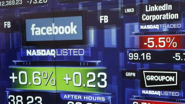 Monitors show the value of the Facebook stock at the closing bell.