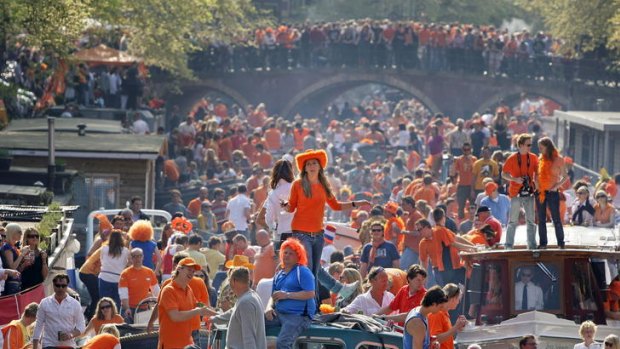 Party time ... Nederlanders show their colours for Queen's Day.