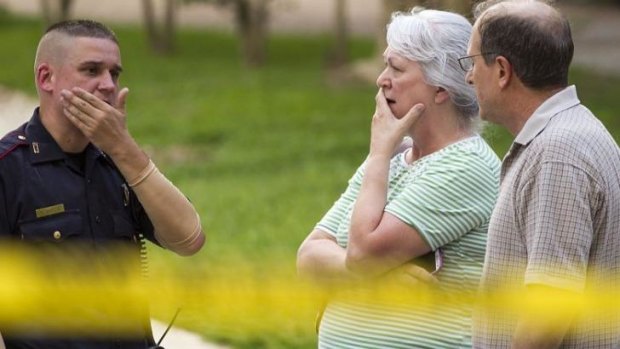 Residents with police near the scene of a mass shooting on Wednesday in Texas.